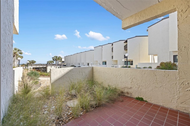 view of yard with a balcony