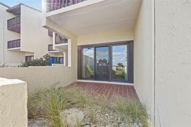 entrance to property with a balcony