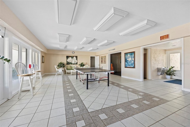 game room featuring light tile patterned floors and plenty of natural light