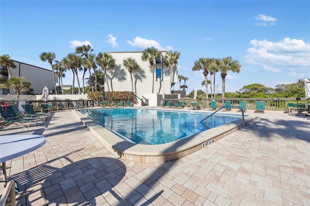 view of swimming pool featuring a patio area