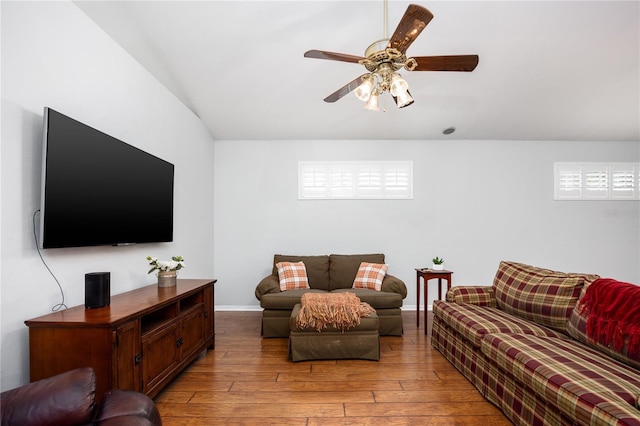 living room with ceiling fan and light wood-type flooring