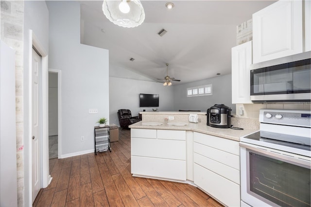 kitchen featuring white range with electric cooktop, white cabinets, dark hardwood / wood-style flooring, ceiling fan, and kitchen peninsula