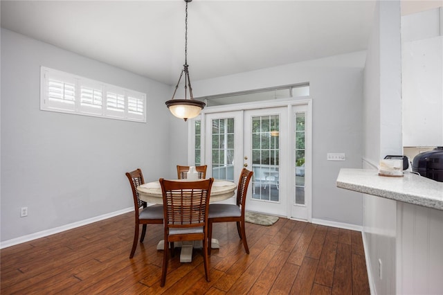 dining area with french doors and dark hardwood / wood-style flooring