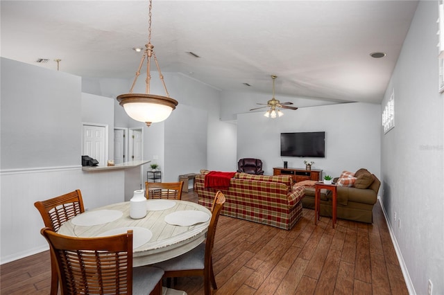 dining area with vaulted ceiling, dark hardwood / wood-style floors, and ceiling fan