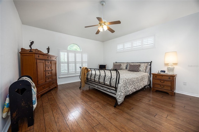 bedroom featuring ceiling fan and dark hardwood / wood-style floors