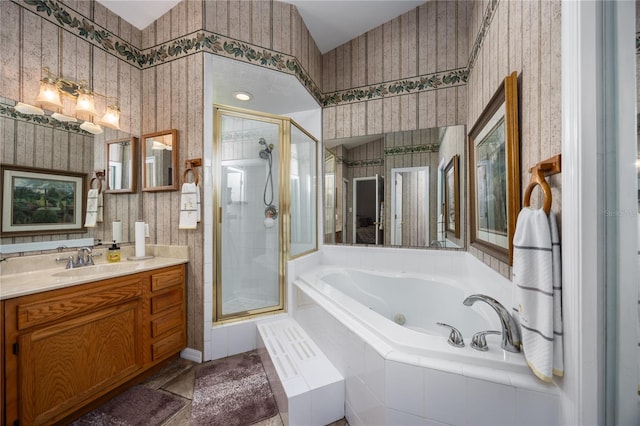 bathroom with independent shower and bath and vanity