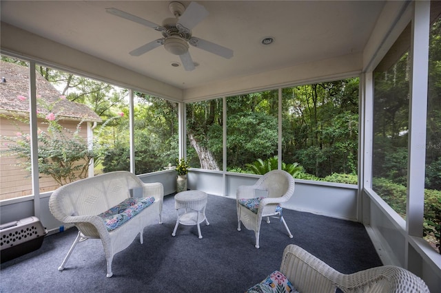 sunroom featuring ceiling fan