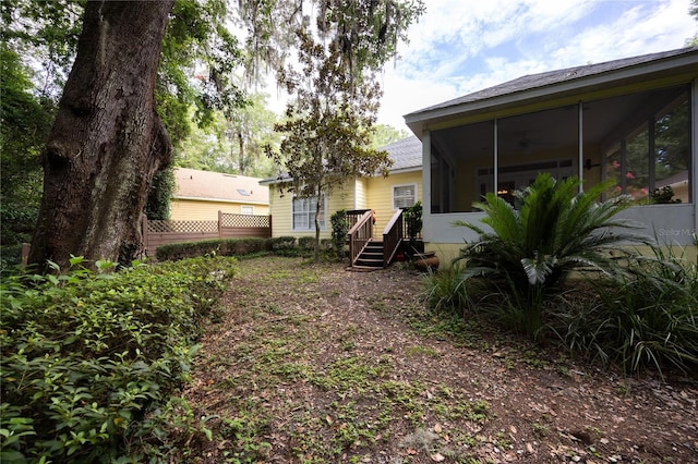 view of yard with a sunroom