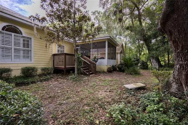 view of yard featuring a sunroom