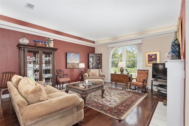 living room featuring crown molding and hardwood / wood-style floors