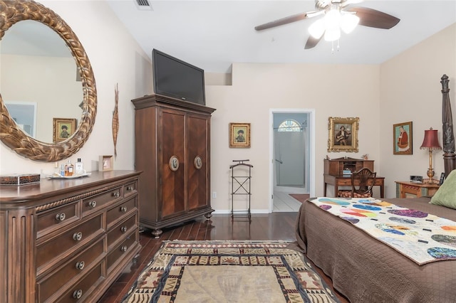 bedroom with ceiling fan, dark hardwood / wood-style flooring, and ensuite bath