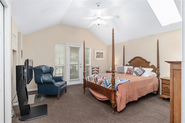 carpeted bedroom with access to outside, lofted ceiling with skylight, and ceiling fan