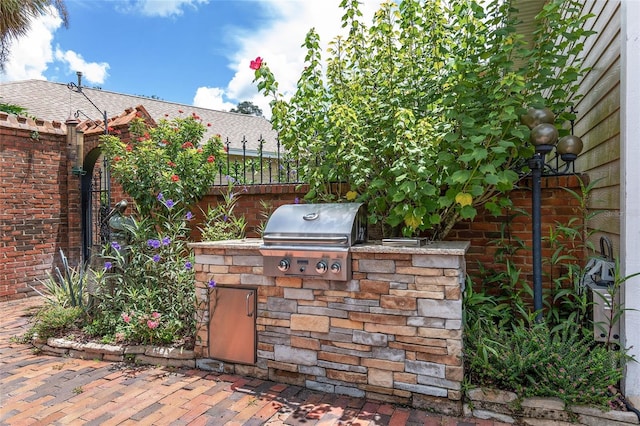 view of patio with exterior kitchen and area for grilling