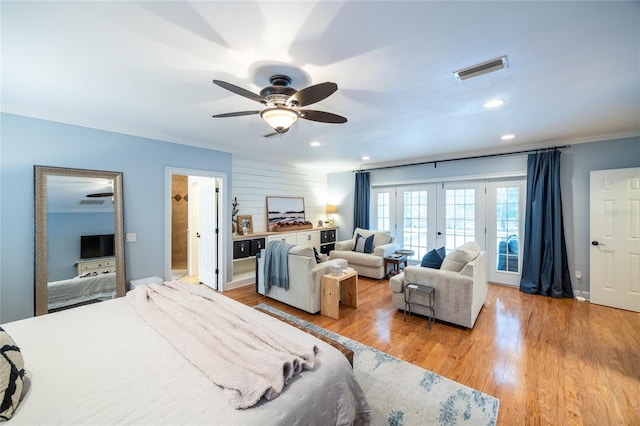 bedroom with french doors, recessed lighting, visible vents, ornamental molding, and light wood-type flooring