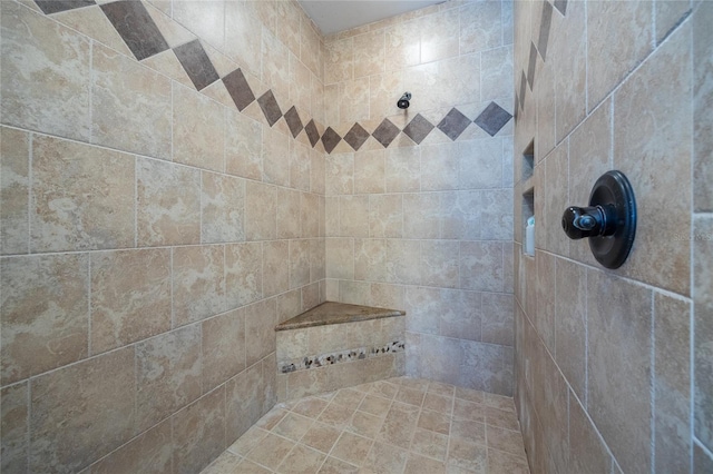 full bath with tiled shower