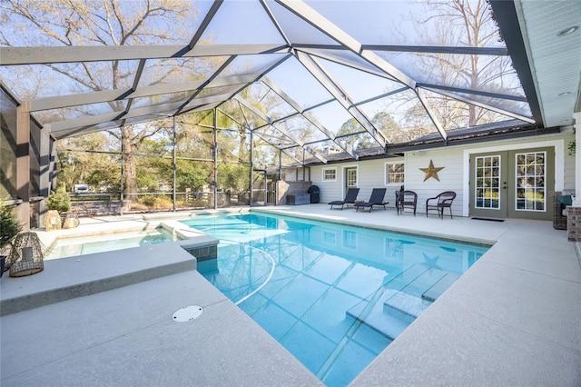 view of pool featuring french doors, a patio, and a lanai