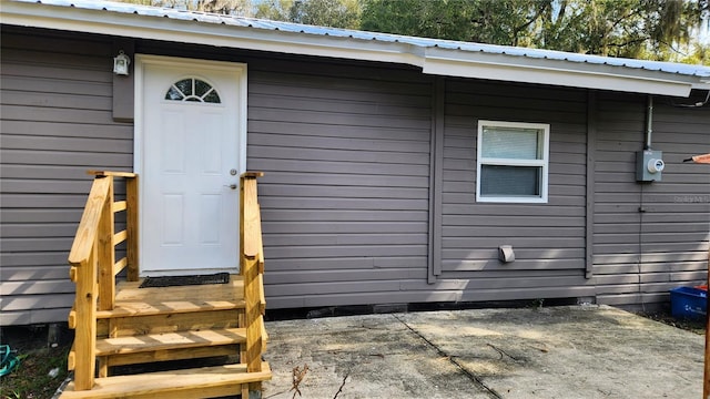 doorway to property featuring a patio area