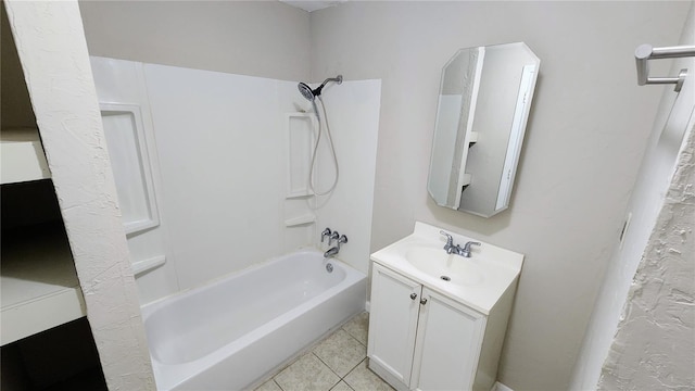 bathroom with tile patterned floors, bathing tub / shower combination, and vanity