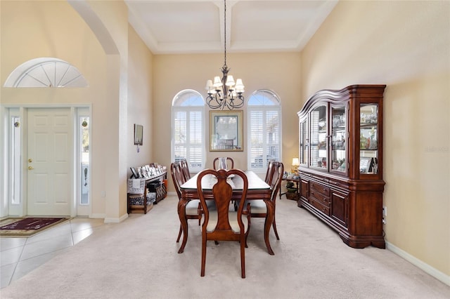 carpeted dining space featuring coffered ceiling, beam ceiling, and a chandelier