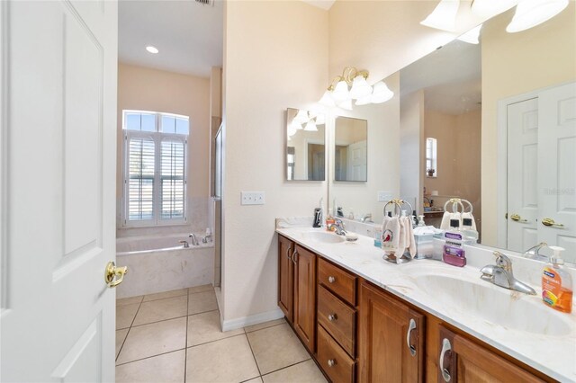 bathroom with vanity, tile patterned floors, and shower with separate bathtub