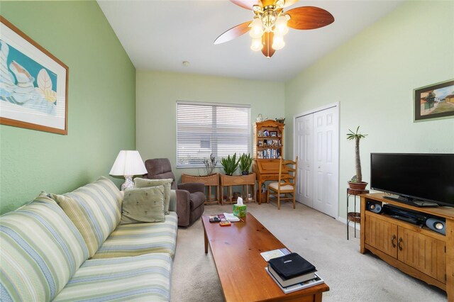 living room featuring ceiling fan and light colored carpet