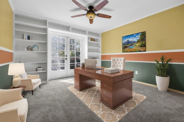 home office with french doors, ceiling fan, light carpet, and built in features