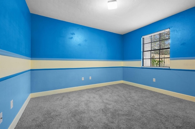 unfurnished room featuring carpet flooring