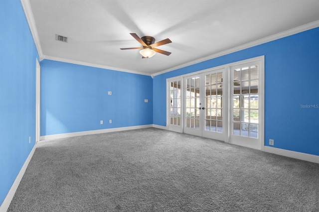 carpeted empty room with french doors, ceiling fan, and crown molding