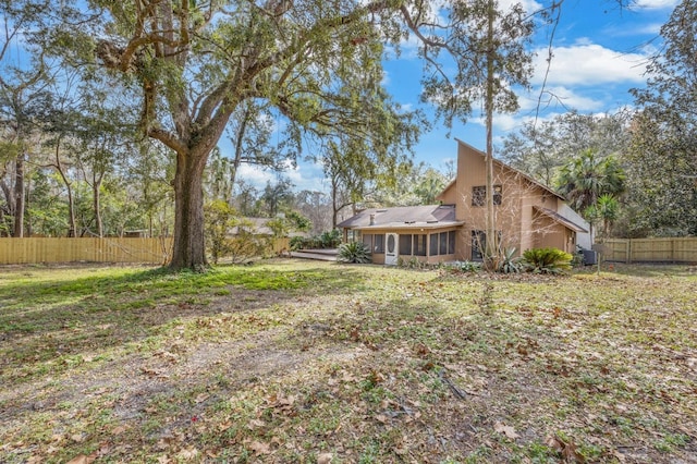 view of yard featuring a sunroom