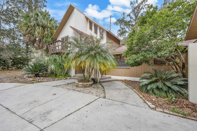 view of front of home with a balcony