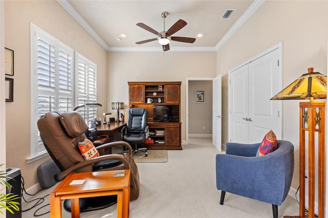 carpeted office space with ceiling fan and ornamental molding