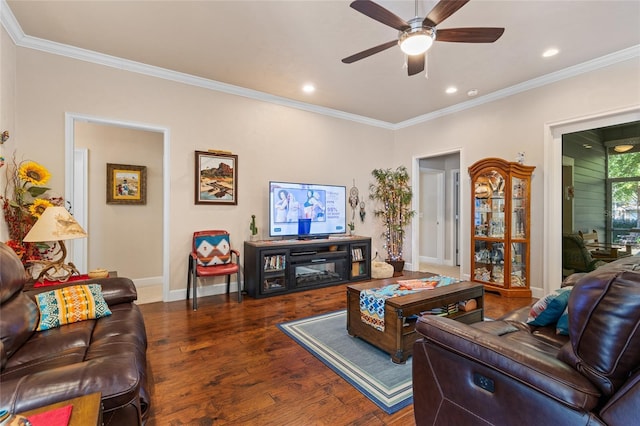 living room featuring dark wood-type flooring, ornamental molding, and ceiling fan