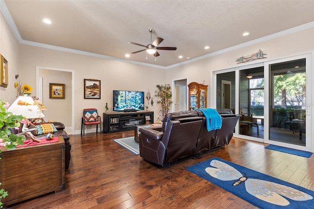 living room featuring dark hardwood / wood-style flooring, ornamental molding, and ceiling fan