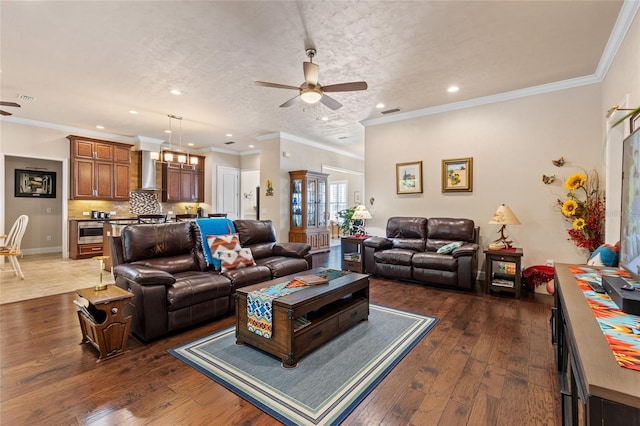 living room with ceiling fan, dark hardwood / wood-style floors, and a textured ceiling