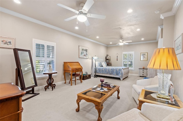 bedroom with light carpet, crown molding, and ceiling fan