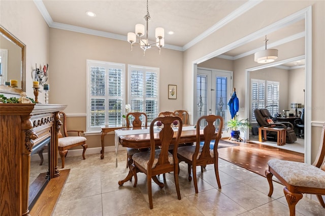 dining room with ornamental molding, plenty of natural light, light tile patterned flooring, and a chandelier