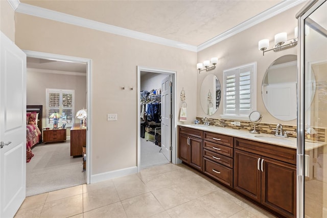 bathroom with crown molding and a healthy amount of sunlight