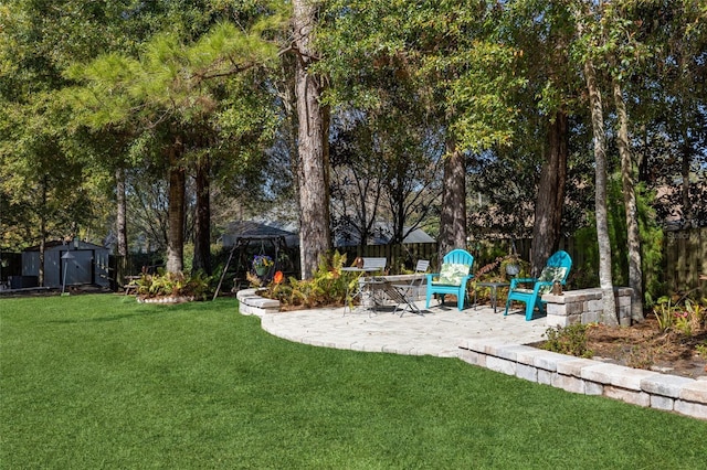 view of yard with a patio and a shed