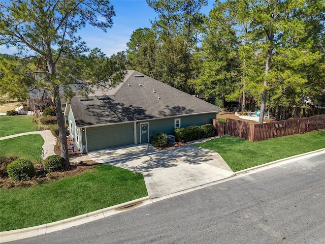 view of front of home featuring a garage and a front lawn