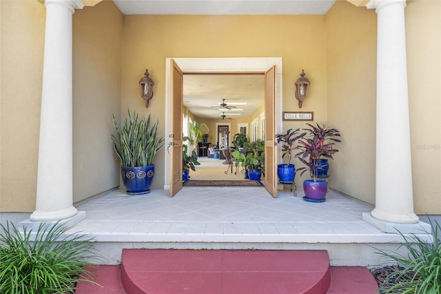 entrance to property featuring stucco siding