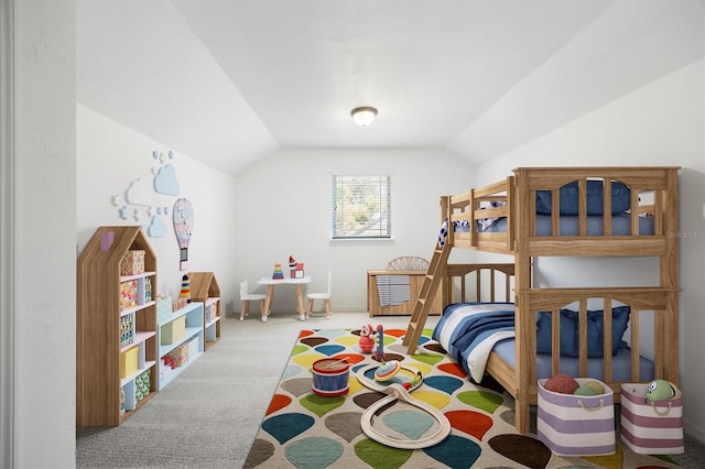 bedroom with lofted ceiling and carpet