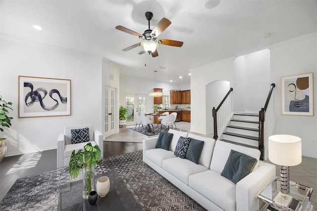 living room featuring recessed lighting, baseboards, stairs, french doors, and crown molding