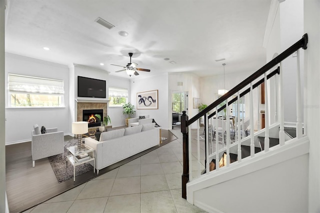 7572 SW 82nd Way, Gainesville, FL 32608 - living room with stairway, a tiled fireplace, ceiling fan, tile patterned floors, and recessed lighting