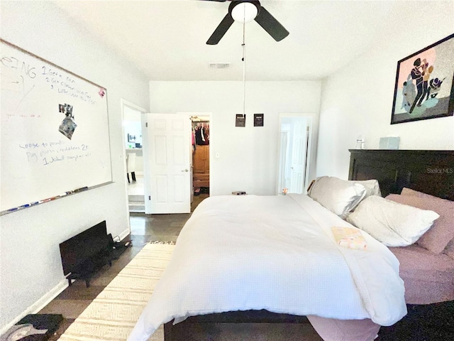 bedroom featuring ceiling fan and a spacious closet