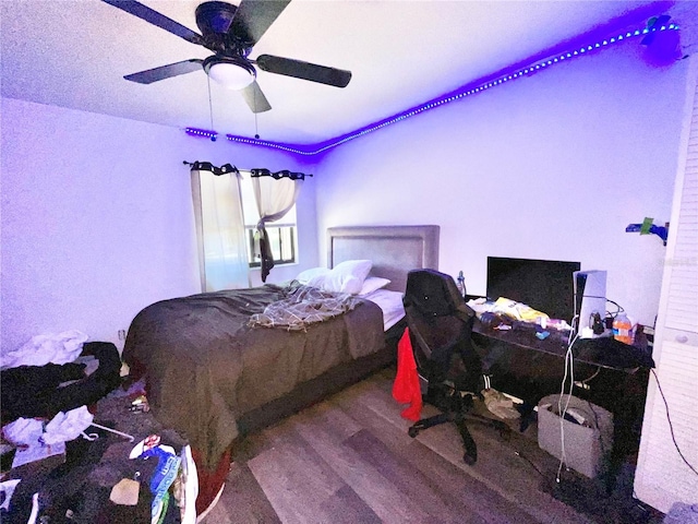 bedroom with hardwood / wood-style floors and ceiling fan