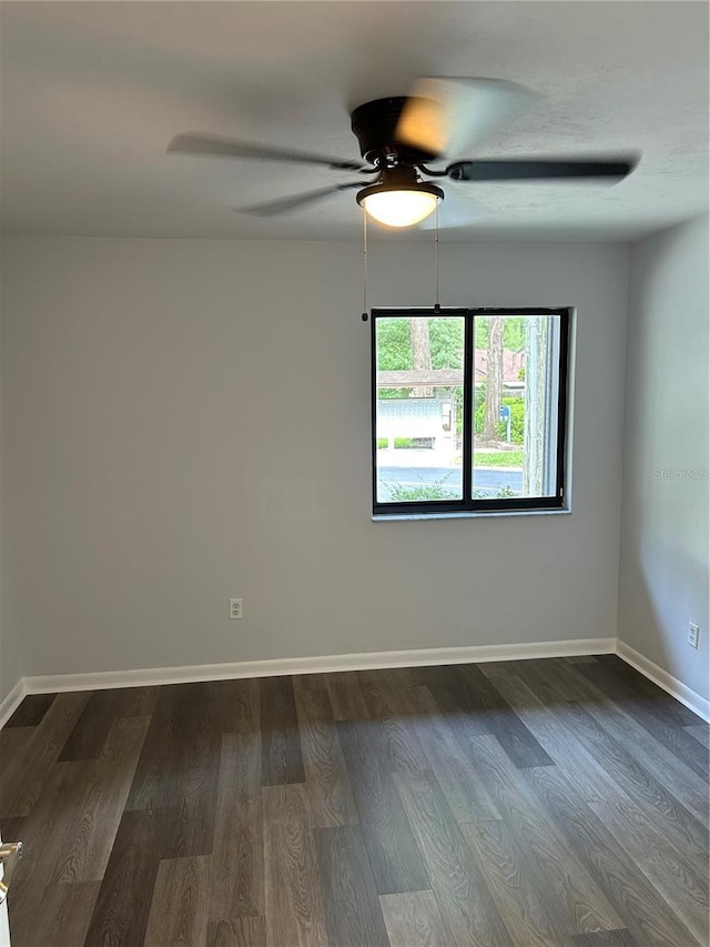 spare room featuring hardwood / wood-style flooring and ceiling fan