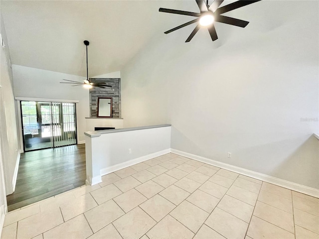2820 NW 39th Ter, Gainesville, FL 32606 - unfurnished room with ceiling fan, high vaulted ceiling, a fireplace, baseboards, and light tile patterned floors