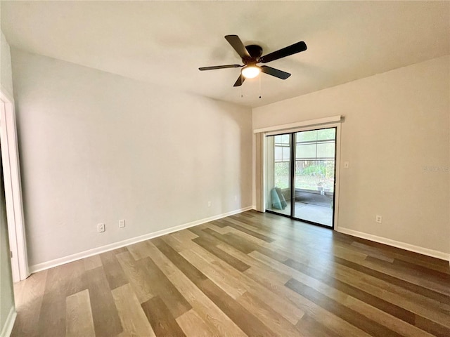 2820 NW 39th Ter, Gainesville, FL 32606 - empty room with wood finished floors, ceiling fan, and baseboards