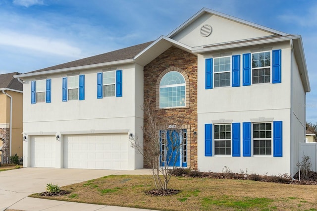 view of front of house with a garage and a front lawn