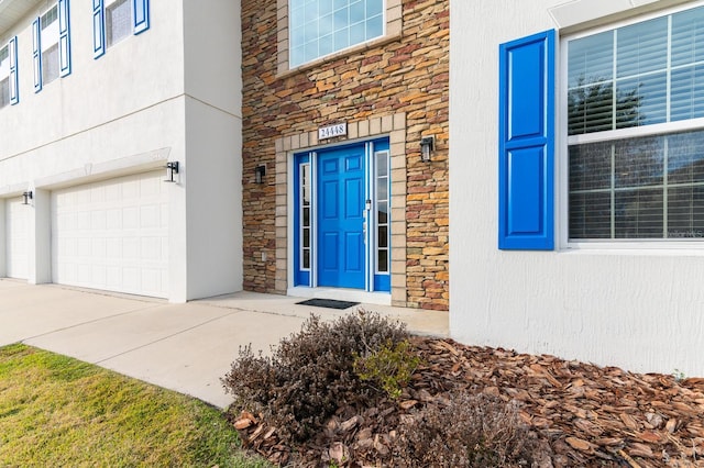 doorway to property featuring a garage